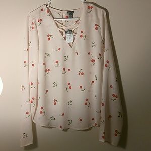 Blouse with cherries on it.